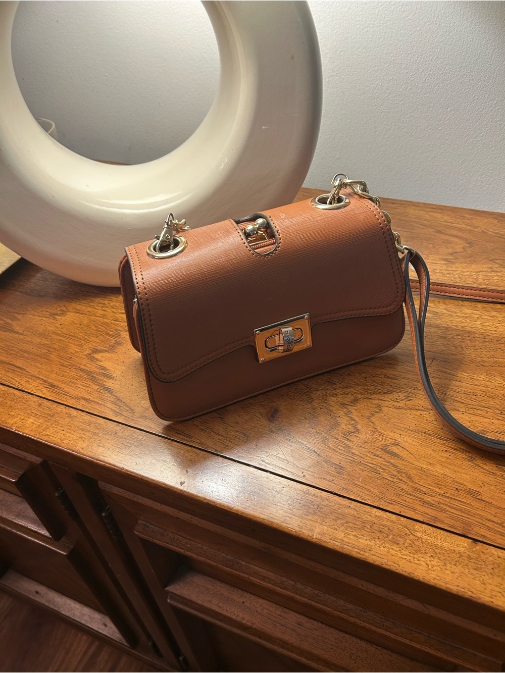 Nicole Lee Brown Crossbody Bag with Gold Turn-Lock Hardware